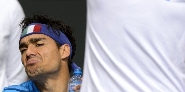 Italy's Fabio Fognini reacts during a break in his match against Switzerland's Stanislas Wawrinka during the second tennis ma
