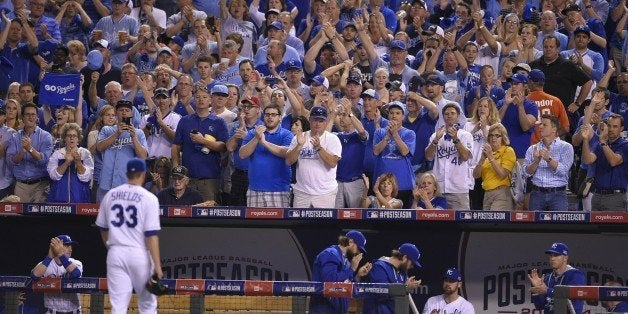 Kansas City Royals starting pitcher James Shields walks off the field as players and fans gave him applause as he leaves the
