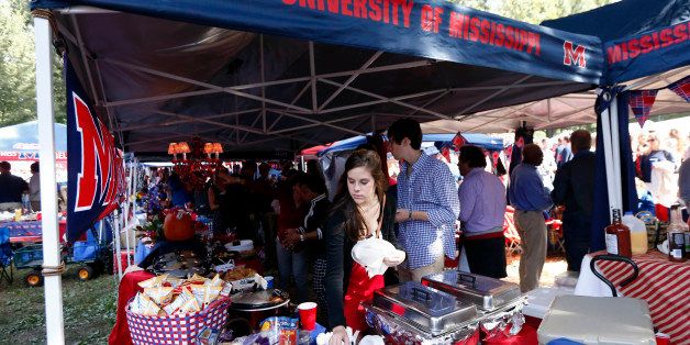 Fans tailgate in The Grove at the University of Mississippi before an NCAA college football game against Alabama in Oxford, Miss., Saturday, Oct. 4, 2014. (AP Photo/Rogelio V. Solis)