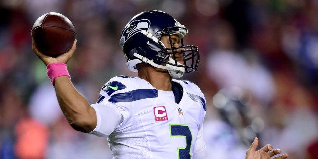 LANDOVER, MD - OCTOBER 06: Quarterback Russell Wilson #3 of the Seattle Seahawks drops back to pass in the first quarter of a game against the Washington Redskins at FedExField on October 6, 2014 in Landover, Maryland. (Photo by Patrick Smith/Getty Images)