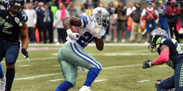 SEATTLE, WA - OCTBER 12: Running back DeMarco Murray #29 of the Dallas Cowboys runs for a touchdown during the fourth quarter of the game against the Seattle Seahawks at CenturyLink Field on October 12, 2014 in Seattle,Washington. (Photo by Steve Dykes/Getty Images)