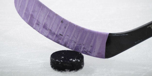 COLUMBUS, OH - OCTOBER 25: Nikita Nikitin #6 of the Columbus Blue Jackets sports purple tape on his stick in support of Hockey Fights Cancer during pre-game warmups prior to the game against the Toronto Maple Leafs on October 25, 2013 at Nationwide Arena in Columbus, Ohio. (Photo by Jamie Sabau/NHLI via Getty Images)