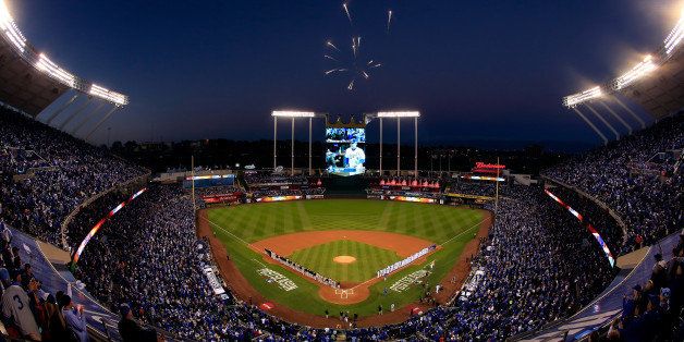 KANSAS CITY, MO - OCTOBER 14: Fireworks explode overhead as the Baltimore Orioles and the Kansas City Royals stand on the baseline during the national anthem prior to Game Three of the American League Championship Series at Kauffman Stadium on October 14, 2014 in Kansas City, Missouri. (Photo by Jamie Squire/Getty Images)