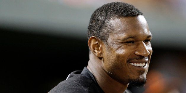 Baltimore Orioles center fielder Adam Jones sits in the dugout during a baseball game against the Minnesota Twins, Friday, Aug. 29, 2014, in Baltimore. (AP Photo/Patrick Semansky)