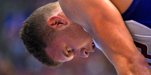 Los Angeles Clippers forward Blake Griffin looks on during the second half in Game 1 of an opening-round NBA basketball playoff series against the Golden State Warriors, Saturday, April 19, 2014, in Los Angeles. The Warriors won 109-105. (AP Photo/Mark J. Terrill)