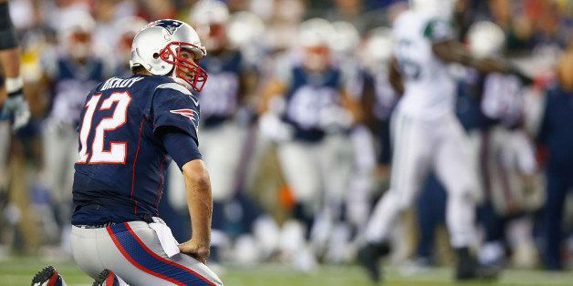 FOXBORO, MA - OCTOBER 16: Tom Brady #12 of the New England Patriots reacts during the third quarter against the New York Jets at Gillette Stadium on October 16, 2014 in Foxboro, Massachusetts. (Photo by Jared Wickerham/Getty Images)