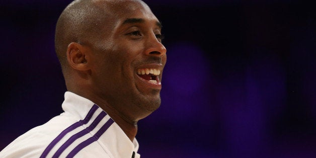 LOS ANGELES, CA - OCTOBER 09: Kobe Bryant #24 of the Los Angeles Lakers smiles prior to the start of the game against the Golden State Warriors at Staples Center on October 9, 2014 in Los Angeles, California. NOTE TO USER: User expressly acknowledges and agrees that, by downloading and or using this photograph, User is consenting to the terms and conditions of the Getty Images License Agreement. (Photo by Jeff Gross/Getty Images)