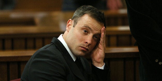 Oscar Pistorius, gestures, at the end of the fourth day of sentencing proceedings in the high court in Pretoria, South Africa, Thursday, Oct. 16, 2014. Following the testimony hearing, which is expected to end this week, Judge Thokozile Masipa will rule on what punishment Pistorius must serve after convicting him of culpable homicide for shooting his girlfriend Reeva Steenkamp through a toilet door in his home.(AP Photo/Alon Skuy, Pool)