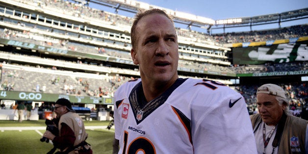 EAST RUTHERFORD, NJ - OCTOBER 12: Peyton Manning (18) of the Denver Broncos walks off the field after the fourth quarter of t