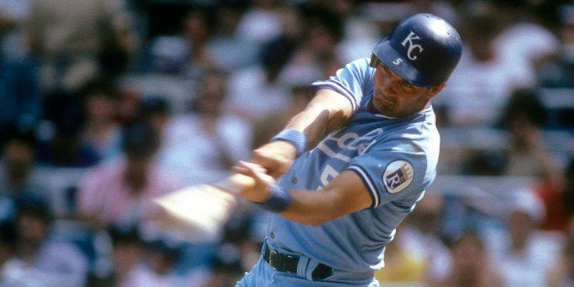 NEW YORK - CIRCA 1985: Third baseman George Brett #5 of the Kansas City Royals swings and watches the flight of his ball against the New York Yankees during a Major League baseball game circa 1985 at Yankee Stadium in the Bronx borough of New York City, New York. Brett played for the Royals from 1973-93. (Photo by Focus on Sport/Getty Images)