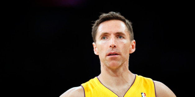 FILE - In this April 1, 2014, file photo, Los Angeles Lakers guard Steve Nash stands on the court during the first half of an NBA basketball game against the Portland Trail Blazers in Los Angeles. The Lakers announced Thursday, Oct. 23, 2014, that Nash has been ruled out for the upcoming season with a back injury, putting the two-time NBA MVPâs career in doubt. (AP Photo/Danny Moloshok, File)