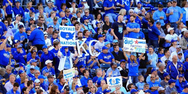 KANSAS CITY, MO - OCTOBER 15: Kansas City Royals fans cheer during Game Four of the American League Championship Series against the Baltimore Orioles at Kauffman Stadium on October 15, 2014 in Kansas City, Missouri. (Photo by Jamie Squire/Getty Images)