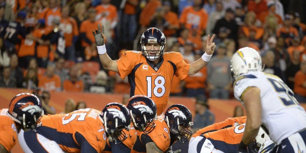 DENVER, CO - OCTOBER 23: Peyton Manning (18) of the Denver Broncos runs the offense during the fourth quarter. The Denver Broncos played the San Diego Chargers at Sports Authority Field at Mile High in Denver on October 23, 2014. (Photo by Tim Rasmussen/The Denver Post via Getty Images)