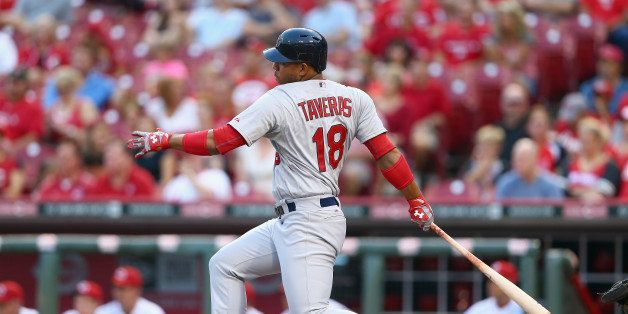 CINCINNATI, OH - SEPTEMBER 10: Oscar Taveras #18 of the St. Louis Cardinals hits an RBI single in the first inning during the game against the Cincinnati Reds at Great American Ball Park on September 10, 2014 in Cincinnati, Ohio. (Photo by Andy Lyons/Getty Images)