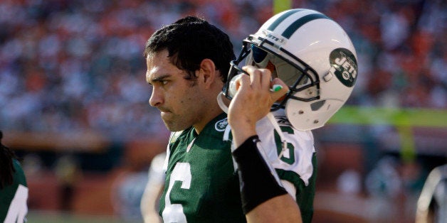 New York Jets quarterback Mark Sanchez (6) stands on the sideline during the final minutes of an NFL football game against th