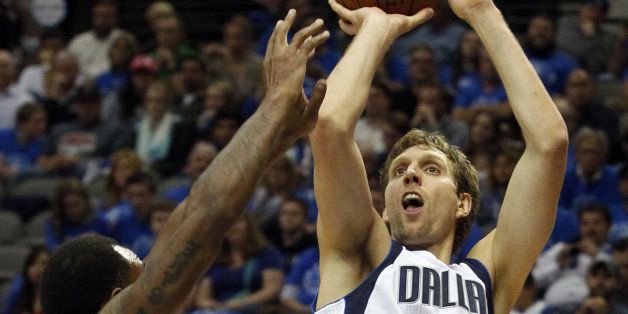 The Utah Jazz' Trevor Booker (33) tries to defends against a shot by the Dallas Mavericks' Dirk Nowitzki (41) at American Airlines Center in Dallas on Thursday, Oct. 30, 2014. The Mavs won, 120-102. (Star-Telegram/ Richard W. Rodriguez)