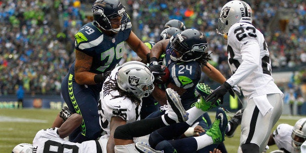 SEATTLE, WA - NOVEMBER 02: Running back Marshawn Lynch #24 of the Seattle Seahawks bulls his way into the end zone for a touc