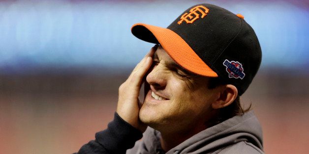 San Francisco Giants second baseman Ryan Theriot rubs his face during baseball practice, Tuesday, Oct. 16, 2012, in St. Louis. The Giants are scheduled to play the St. Louis Cardinals in Game 3 of baseball's National League championship series Wednesday in St. Louis. (AP Photo/Jeff Roberson)