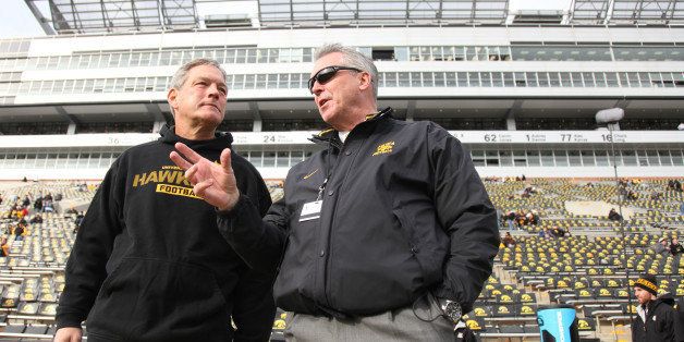 IOWA CITY, IA - OCTOBER 26: Head coach Kirk Ferentz of the Iowa Hawkeyes visits with athletic director Gary Barta prior to the match-up against the Northwestern Wildcats on October 26, 2013 at Kinnick Stadium in Iowa City, Iowa. (Photo by Matthew Holst/Getty Images)