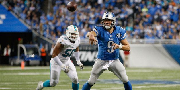 DETROIT, MI - NOVEMBER 09: Matthew Stafford #9 of the Detroit Lions throws an 11 yard fourth quarter pass that results in a touchdown against the Miami Dolphins at Ford Field on November 09, 2014 in Detroit, Michigan. (Photo by Joe Robbins/Getty Images)