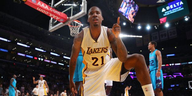 LOS ANGELES, CA - NOVEMBER 09: Ed Davis #21 of the Los Angeles Lakers gestures after making a shot while drawing a foul call in the second half against the Charlotte Hornets during the NBA game at Staples Center on November 9, 2014 in Los Angeles, California. NOTE TO USER: User expressly acknowledges and agrees that, by downloading and/or using this photograph, user is consenting to the terms and conditions of the Getty Images License Agreement. Mandatory copyright notice. (Photo by Victor Decolongon/Getty Images)