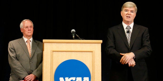 INDIANAPOLIS, IN - JULY 23: NCAA president Mark Emmert (R) speaks as Ed Ray, chairman of the NCAA's executive committee and O
