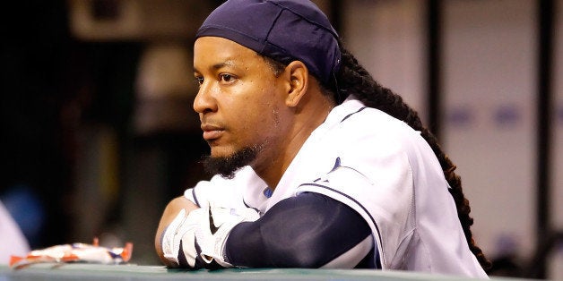 ST. PETERSBURG, FL - APRIL 05: Designated hitter Manny Ramirez #24 of the Tampa Bay Rays watches his team from the dugout ag