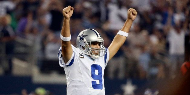 Dallas Cowboys' Tony Romo celebrates a touchdown runby DeMarco Murray during the second half of an NFL football game against the New Orleans Saints, Sunday, Sept. 28, 2014, in Arlington, Texas. (AP Photo/Brandon Wade)