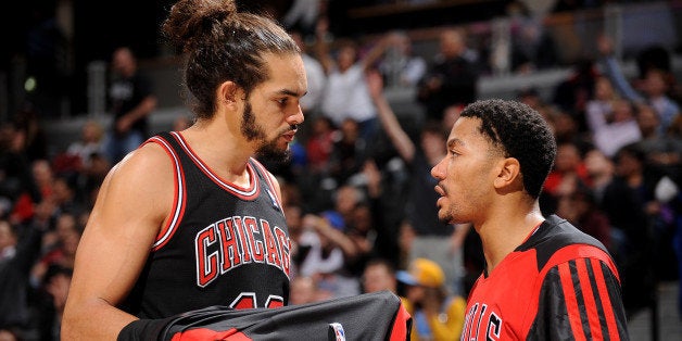 DENVER, CO - NOVEMBER 21: Joakim Noah #13 and Derrick Rose #1 of the Chicago Bulls talk during the game against the Denver N