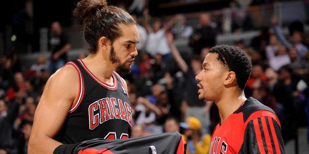 DENVER, CO - NOVEMBER 21: Joakim Noah #13 and Derrick Rose #1 of the Chicago Bulls talk during the game against the Denver Nuggets on November 21, 2013 at the Pepsi Center in Denver, Colorado. NOTE TO USER: User expressly acknowledges and agrees that, by downloading and/or using this Photograph, user is consenting to the terms and conditions of the Getty Images License Agreement. Mandatory Copyright Notice: Copyright 2013 NBAE (Photo by Bart Young/NBAE via Getty Images)