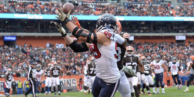 CLEVELAND, OH - NOVEMBER 16: J.J. Watt #99 of the Houston Texans makes a touchdown catch in front of Chris Kirksey #58 of the Cleveland Browns during the first quarter at FirstEnergy Stadium on November 16, 2014 in Cleveland, Ohio. (Photo by Jason Miller/Getty Images)