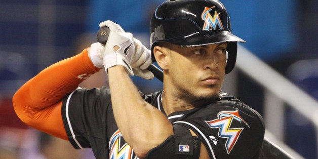 MIAMI, FL - SEPTEMBER 06: Giancarlo Stanton #27 of the Miami Marlins bats against the Atanta Braves during the first inning