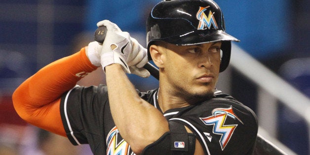 MIAMI, FL - SEPTEMBER 06: Giancarlo Stanton #27 of the Miami Marlins bats against the Atanta Braves during the first inning at Marlins Park on September 6, 2014 in Miami, Florida. The Braves defeated the Marlins 4-3. (Photo by Marc Serota/Getty Images)