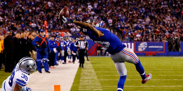 EAST RUTHERFORD, NJ - NOVEMBER 23: Odell Beckham #13 of the New York Giants scores a touchdown in the second quarter against the Dallas Cowboys at MetLife Stadium on November 23, 2014 in East Rutherford, New Jersey. (Photo by Al Bello/Getty Images)