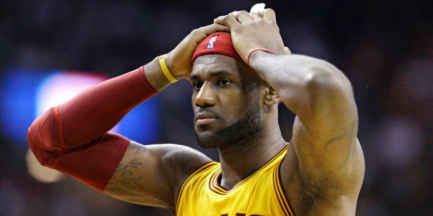 Cleveland Cavaliers' LeBron James reacts when he does not get a foul called against the San Antonio Spurs during an NBA basketball game Wednesday, Nov. 19, 2014, in Cleveland. (AP Photo/Tony Dejak)