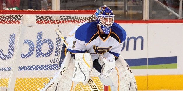 GLENDALE, AZ - MARCH 25: Goaltender Brian Elliot #1 of the St Louis Blues gets ready to make a save against the Phoenix Coyotes at Jobing.com Arena on March 25, 2012 in Glendale, Arizona. (Photo by Norm Hall/NHLI via Getty Images)