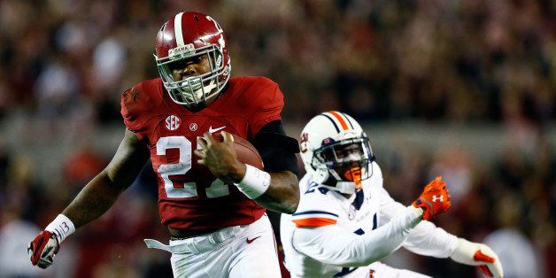 TUSCALOOSA, AL - NOVEMBER 29: Derrick Henry #27 of the Alabama Crimson Tide runs the ball in the fourth quarter against the Auburn Tigers during the Iron Bowl at Bryant-Denny Stadium on November 29, 2014 in Tuscaloosa, Alabama. (Photo by Kevin C. Cox/Getty Images)