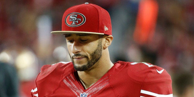 San Francisco 49ers quarterback Colin Kaepernick (7) stands on the sideline during the fourth quarter of an NFL football game against the Seattle Seahawks in Santa Clara, Calif., Thursday, Nov. 27, 2014. The Seahawks 19-3. (AP Photo/Tony Avelar)