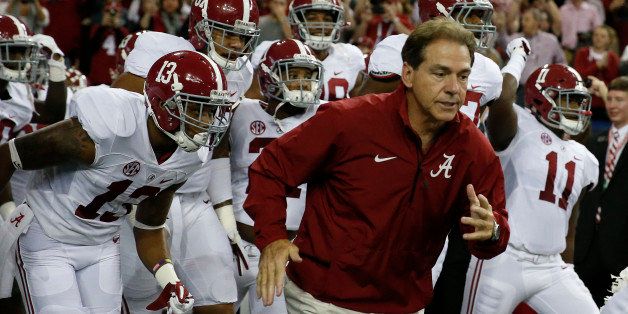 Alabama head coach Nick Saban takes the field with his team before the first half of the Southeastern Conference championship NCAA college football game against Missouri, Saturday, Dec. 6, 2014, in Atlanta. (AP Photo/Brynn Anderson)