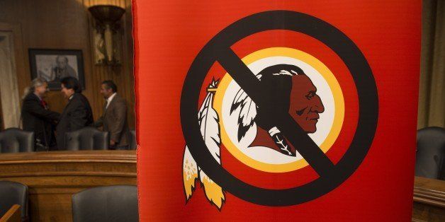 A poster for the 'Change the Mascot' campaign is seen prior to a press conference by the Oneida Indian Nation leaders on Capitol Hill in Washington, DC, September 16, 2014. 'Change the Mascot' is a national campaign to end the use of the racial slur Redskins as the mascot and name of the NFL team in Washington, DC. Launched by the Oneida Indian Nation, the campaign calls upon the NFL and Commissioner Roger Goodell to do the right thing and bring an end the use of the racial epithet. AFP PHOTO / Saul LOEB (Photo credit should read SAUL LOEB/AFP/Getty Images)