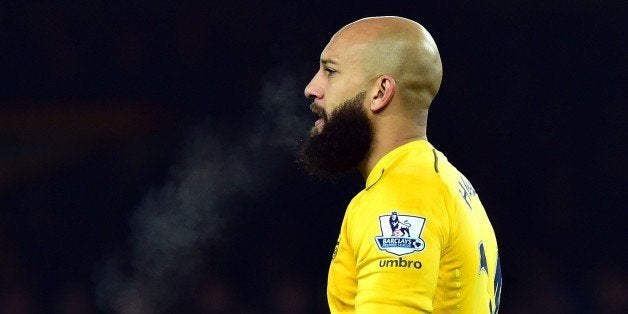 Everton's US goalkeeper Tim Howard looks on during the English Premier League football match between Everton and Hull City at Goodison Park in Liverpool, north west England on December 3, 2014. AFP PHOTO / PAUL ELLISRESTRICTED TO EDITORIAL USE. No use with unauthorized audio, video, data, fixture lists, club/league logos or live services. Online in-match use limited to 45 images, no video emulation. No use in betting, games or single club/league/player publications. (Photo credit should read PAUL ELLIS/AFP/Getty Images)