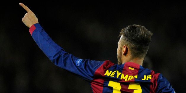 Barcelona's Neymar celebrates his side's 2nd goal during the Group F Champions League soccer match between FC Barcelona and PSG at the Camp Nou stadium in Barcelona, Spain, Wednesday Dec. 10, 2014. (AP Photo/Manu Fernandez)