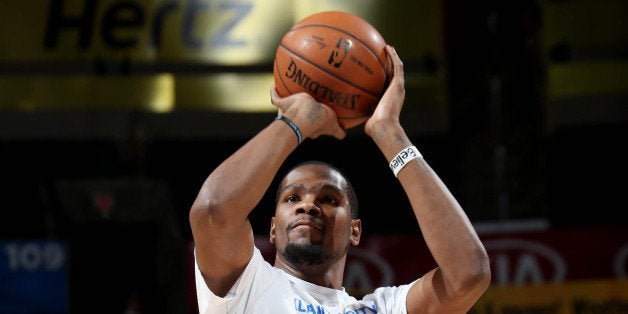 OKLAHOMA CITY, OK- DECEMBER 23: Kevin Durant #35 of the Oklahoma City Thunder warms up before a game against the Portland Trail Blazers on December 23, 2014 at Chesapeake Energy Arena in Oklahoma City, OK. NOTE TO USER: User expressly acknowledges and agrees that, by downloading and or using this photograph, User is consenting to the terms and conditions of the Getty Images License Agreement. Mandatory Copyright Notice: Copyright 2014 NBAE (Photo by Layne Murdoch/NBAE via Getty Images)