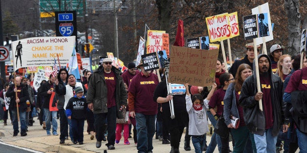 LANDOVER, MD - DECEMBER 28:Native Americans and supporters protesting the name and logo of the Washington Football team before the game on Sunday, December 28, 2014. The protesters could not get on to the grounds at FedEx Field so Jericho City of Praise is offered them space. (Photo by Toni L. Sandys/The Washington Post via Getty Images)