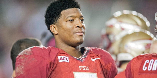 TALLAHASSEE, FL - NOVEMBER 23: Jameis Winston #5 of the Florida State Seminoles rests on the sideline during the second half
