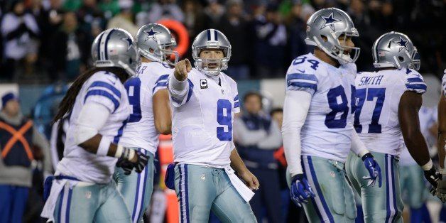 FILE - In this Dec. 14, 2014, file photo, Dallas Cowboys' Tony Romo gestures during the second half of an NFL football game against the Philadelphia Eagles in Philadelphia. Rather than plummet despite an undertalented defense and questionable coaching, Dallas has surged to the NFC East title, possibly a first-round playoff bye. (AP Photo/Michael Perez, File)