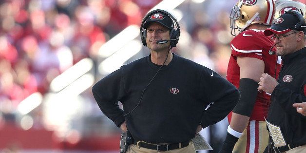 SANTA CLARA, CA - DECEMBER 28: head coach Jim Harbaugh of the San Francisco 49ers watches a touchdown from the Arizona Cardinals in the first quarter at Levi's Stadium on December 28, 2014 in Santa Clara, California. (Photo by Don Feria/Getty Images)