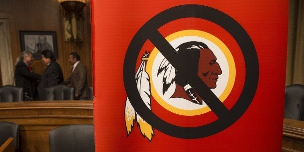 A poster for the 'Change the Mascot' campaign is seen prior to a press conference by the Oneida Indian Nation leaders on Capitol Hill in Washington, DC, September 16, 2014. 'Change the Mascot' is a national campaign to end the use of the racial slur Redskins as the mascot and name of the NFL team in Washington, DC. Launched by the Oneida Indian Nation, the campaign calls upon the NFL and Commissioner Roger Goodell to do the right thing and bring an end the use of the racial epithet. AFP PHOTO / Saul LOEB (Photo credit should read SAUL LOEB/AFP/Getty Images)