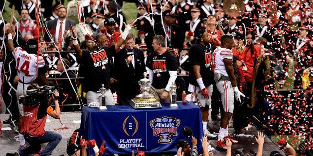 NEW ORLEANS, LA - JANUARY 01: Head coach Urban Meyer and the Ohio State Buckeyes celebrate with the trophy after defeating the Alabama Crimson Tide in the All State Sugar Bowl at the Mercedes-Benz Superdome on January 1, 2015 in New Orleans, Louisiana. The Ohio State Buckeyes defeated the Alabama Crimson Tide 42 to 35. (Photo by Stacy Revere/Getty Images)