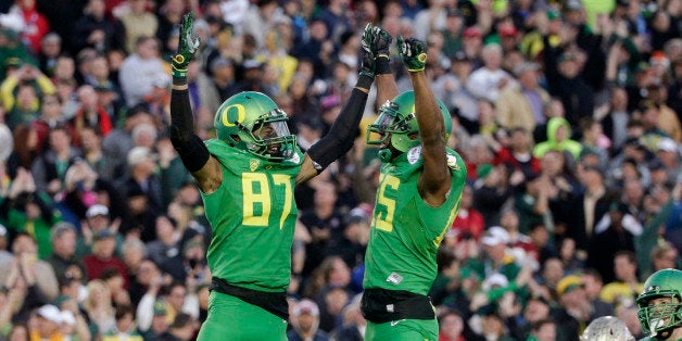 Oregon wide receiver Darren Carrington, left, celebrates his touchdown with tight end Pharaoh Brown during the second half of the Rose Bowl NCAA college football playoff semifinal against Florida State, Thursday, Jan. 1, 2015, in Pasadena, Calif. (AP Photo/Jae C. Hong)